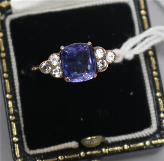 A gold and sapphire set dress ring, with white sapphire? set shoulders, size Q.